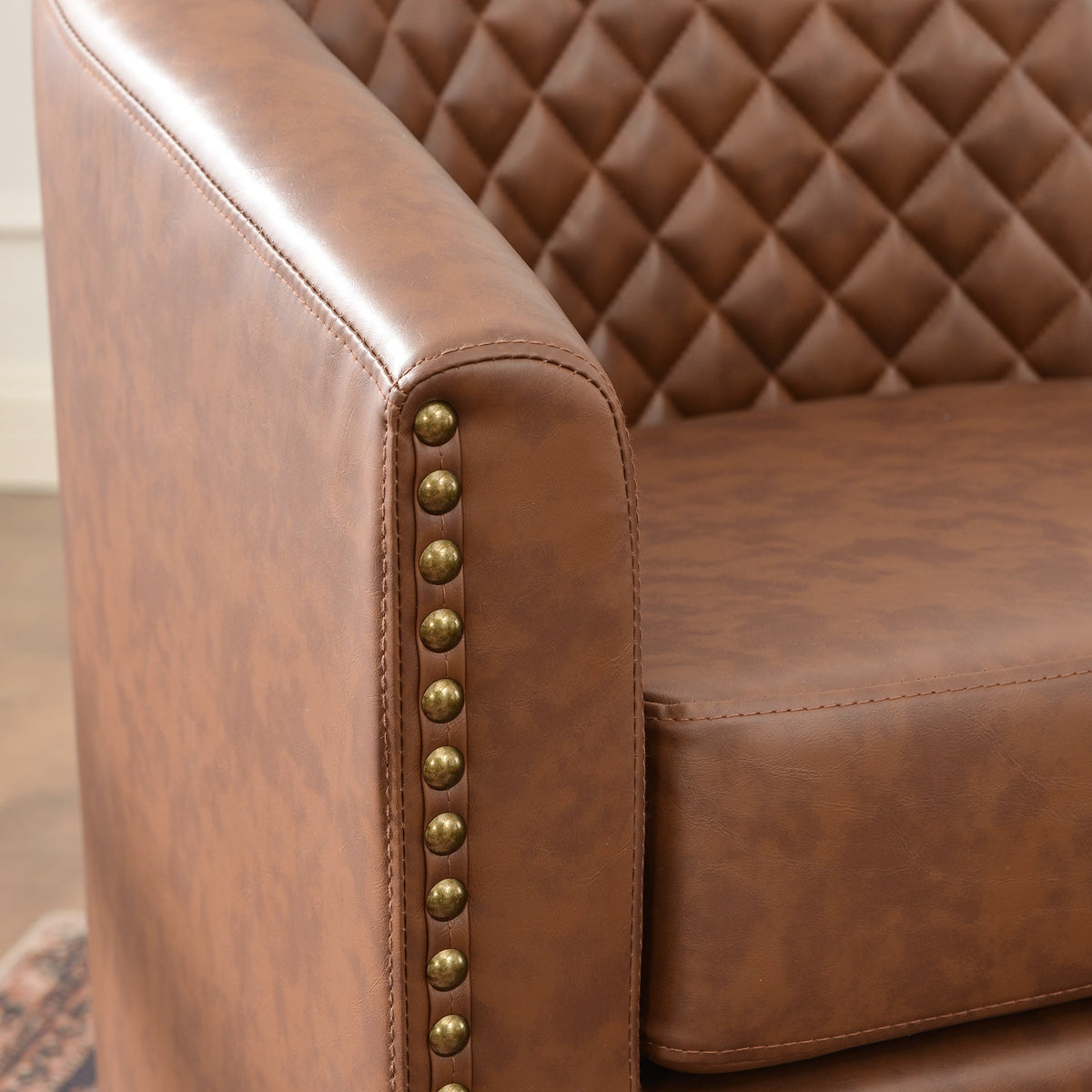 Logan Faux Leather Tufted Swivel Club Chair