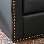 Logan Faux Leather Tufted Swivel Club Chair