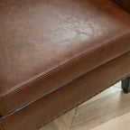 Logan Faux Leather Tufted Club Chair